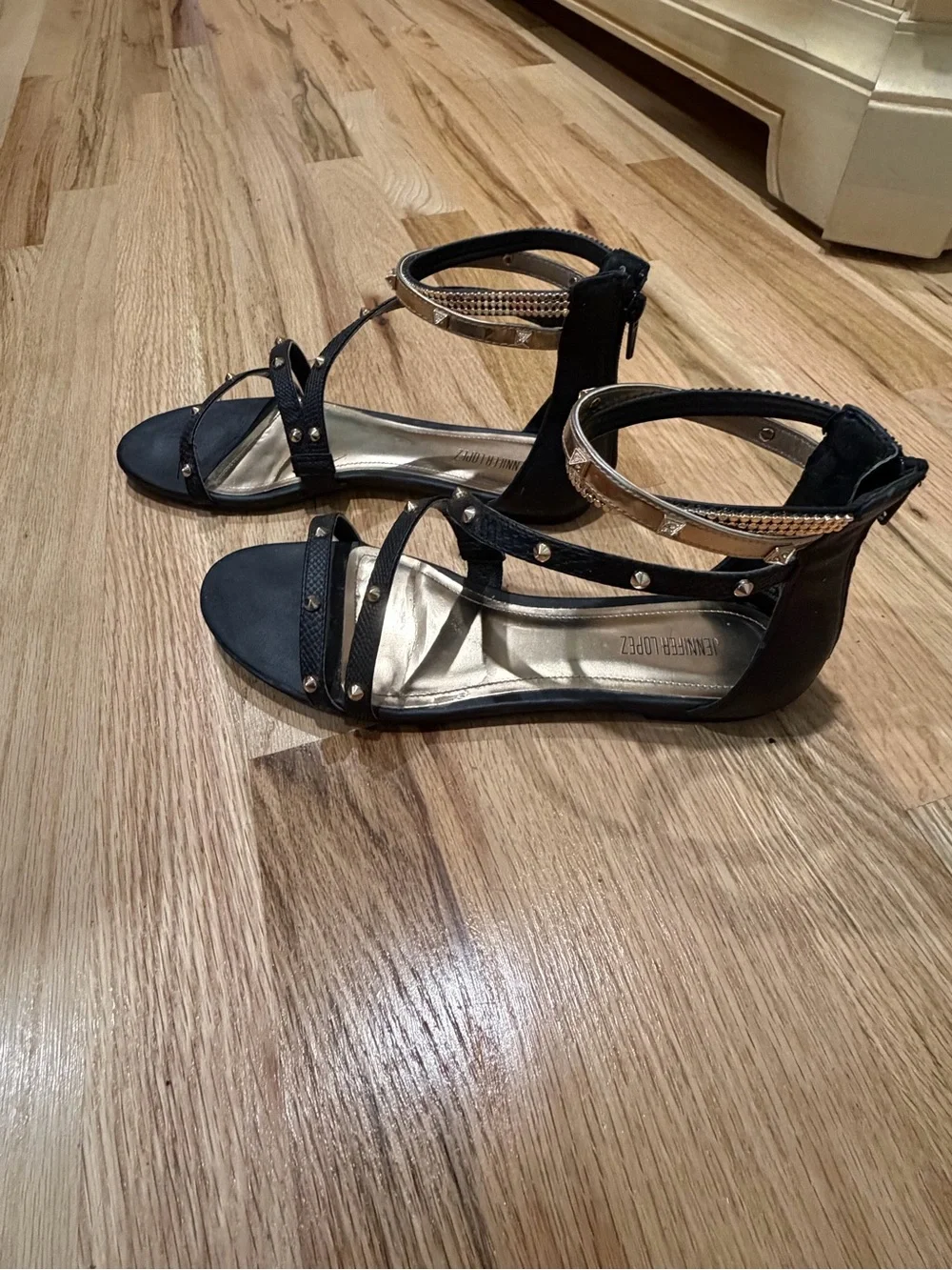 Jennifer Lopez Black Gladiator Sandals with Gold Accents.  Size 8